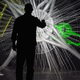 A member of an engineering team using the 3-D Computer-Assisted Virtual Environment (CAVE) at Idaho National Laboratory's Center for Advanced Energy Studies. The tool can be used to tour a virtual nuclear reactor and consider new designs.